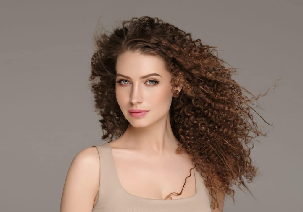 Beautiful hair woman long curly hairstyle female model glamour portrait